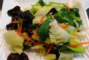 a whole food plant based dish with carrots, shitake and kale